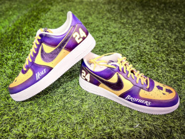 A pair of custom-designed Nike Air Force 1 sneakers with the number 24 and the name "Holt" on one shoe, and the word "Brothers" on the other.

